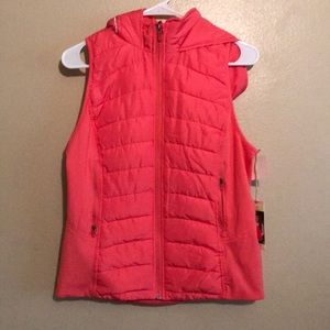 A hoddie vest in color mango